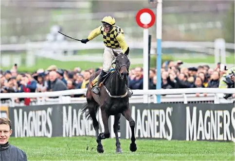  ??  ?? Galloping success: Paul Townend celebrates his Gold Cup victory riding Al Boum Photo at the Cheltenham Festival last year; and (left) the jockey at Willie Mullins’s Closutton yard in County Carlow