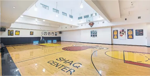  ?? THE AGENCY PHOTOS ?? The massive indoor basketball court at basketball legend Shaquille O’Neal’s 31,000-sq.-ft. home in Orlando, Fla., even has its own bleachers.