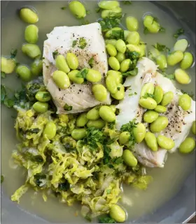  ?? CHEYENNE COHEN/KATIE WORKMAN VIA AP ?? This 2018 photo provided by Katie Workman shows a dish of cod, cabbage and edamame taken in New York. Cabbage, that taken-forgranted vegetable, that sturdy, dense staple of many a poor, ancestral homeland, is finally getting respect.