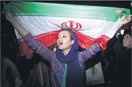  ?? Picture / AP ?? Celebratio­ns in Tehran this week to mark the US- Iran deal . . . but elsewhere the two countries are still working against each other.