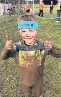  ??  ?? Ollie Mills after completing the Little Mudder