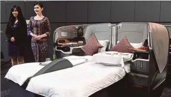  ?? AFP PIC ?? For top-end customers, Singapore Air has cut the number of suites to six from 12, allowing more space for a separate flat bed and fully adjustable seat with leather upholstery by Italy’s Poltrona Frau.