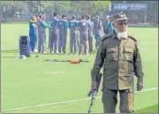  ?? AP ?? A Pakistani police officer stands guard (above) while cricketers attend a training session in Lahore on Pakistan. (Top) Mounted police stand guard outside the Gaddafi Stadium in Lahore on Monday.