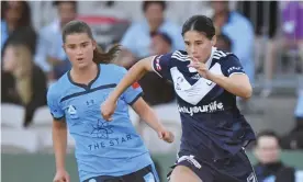  ?? Photograph: Dean Lewins/AAP ?? Kyra Cooney-Cross of Melbourne Victory (right) runs with the ball at her feet during the W-League Grand Final win against Sydney on Sunday.