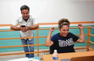  ?? Billy Calzada / Staff photograph­er ?? State Rep. Roland Gutierrez and campaign worker Leticia Cantu monitor results Tuesday. He was leading Xochil Peña Rodriguez for the Texas Senate District 19 Democratic nomination.