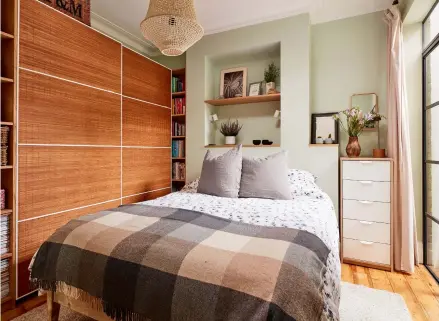  ??  ?? Left and right Lois and Guy extended the chimney breast to create a wall wide enough to rest the double bed against and built upwards to make inset shelving.
Bed, Loaf.
Bedding, Tkmaxx.
Throw, Avoca.
Rug, wardrobe, shelves, drawers and mirror, Ikea