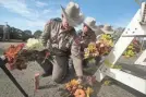  ?? SCOTT OLSON/GETTY IMAGES ?? Police move flowers from a barricade near the First Baptist Church in Sutherland Springs, Texas, on Monday.