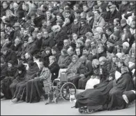  ?? AP/FRANCOIS MORI ?? Some of the people wounded in the Nov. 13 Paris attacks attend a somber ceremony Friday at Les Invalides national monument that honored the victims of the attacks.