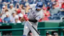  ?? Associated Press ?? Texas Rangers' Shin-Soo Choo singles to left field Sunday during the first inning of a baseball game against the Washington Nationals in Washington.