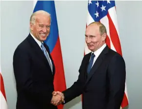  ??  ?? No more Mr Nice Guy: In this 2011 photo, then-Vice President Biden (left) shakes hands with Putin in Moscow. It has been a tit for tat for the two superpower­s after the Biden administra­tion hit Russia with a barrage of new sanctions. — AP