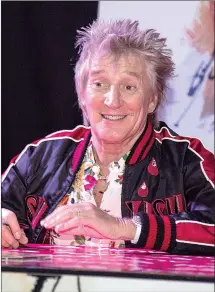  ?? Famous/Ace Pictures/Zuma Press/TNS ?? Rod Stewart signs copies of his new album “Blood Red Roses” on Oct. 3 at HMV Oxford Street in London.