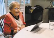  ?? Paul Chinn / The Chronicle ?? Norma Ratto reads digital editions of newspapers at her home in Lafayette. Ratto, once the hairstylis­t for fitness guru Jack LaLanne, turns 100 on Oct. 24.