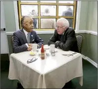  ?? AP/RICHARD DREW ?? The Rev. Al Sharpton talks with Democratic presidenti­al candidate Bernie Sanders at a breakfast meeting Wednesday at Sylvia’s Restaurant in Harlem. Former NAACP leader Benjamin Jealous, who recently endorsed Sanders, also attended the meeting.