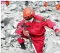  ?? AP ?? A paramilita­ry rescuer uses a sensor to check for signs of life in the rubble at the site of a landslide in China’s Sichuan Province. —