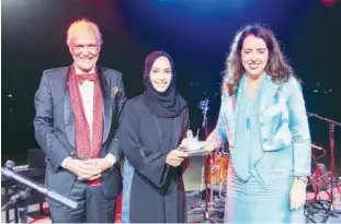  ??  ?? Dr Manal Taryam receives the Lady of the Matterhorn award from the ambassador of Switzerlan­d to the UAE, Mrs Maya Tissafi, alongside Peter Harradine, President of the Swiss Business Council Dubai and Northern Emirates.