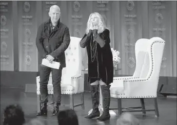  ?? Jay L. Clendenin Los Angeles Times ?? BARBRA STREISAND greets the audience with Q&A emcee Ryan Murphy on Friday at the Dolby Theatre.