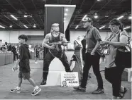  ?? Emil Lippe/New York Times ?? People attend the Conservati­ve Political Action Conference on Friday in Dallas. A straw poll showed Donald Trump as a clear favorite for office.