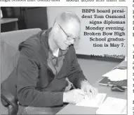  ?? Mona Weatherly ?? BBPS board president Tom Osmond signs diplomas Monday evening. Broken Bow High School graduation is May 7.
