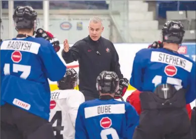  ?? The Canadian Press ?? Team Canada head coach Dominique Ducharme goes over a drill during the opening day of the world-junior selection camp in Boisbriand, Que., on Sunday. Two former Penticton Vees players, forward Tyson Jost from the University of North Dakota and...