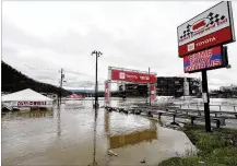  ?? WADE PAYNE / ASSOCIATED PRESS ?? Water floods the vendor area as races for both the Truck Series and NASCAR Cup Series auto race were postponed due to inclement weather at Bristol Motor Speedway on Sunday in Bristol, Tenn.