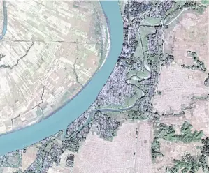  ?? AP/DIGITALGLO­BE ?? A satellite image shows levelled Rohingya villages in Rakhine state.