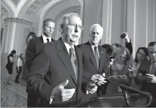  ?? Associated Press ??    Senate Majority Leader Mitch McConnell, R-Ky., flanked by Sen. John Thune, R-S.D., left, and Senate Majority Whip John Cornyn, R-Texas, speaks with reporters Tuesday at the Capitol in Washington following weekly policy luncheons where they discussed...