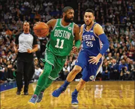  ?? DAN MULLAN / GETTY IMAGES ?? Celtics guard Kyrie Irving, dribbling past the 76ers’ Ben Simmons, had 20 points, seven assists and six rebounds in Boston’s win Thursday in London.