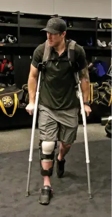  ?? STuART CAHILL / HeRALd sTAFF FILe ?? LONG TIME COMING: Bruins defenseman Kevan Miller is seen on crutches on June 14. 2019. The veteran blueliner is finally healthy after breaking his knee cap a couple seasons ago.