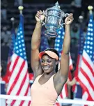  ??  ?? Winning smile: Sloane Stephens holds aloft the US Open trophy after her win