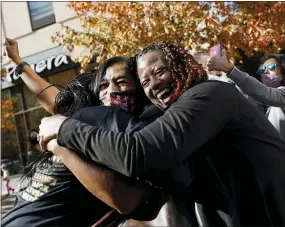  ?? AP PHOTO/REBECCA BLACKWELL ?? People celebrate Saturday in Philadelph­ia after Democrat Joe Biden defeated President Donald Trump to become 46th president of the United States.