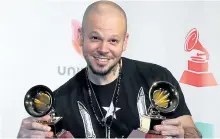  ?? JUDY EDDY/ WENN.COM ?? Rapper Residente shows off his awards at the 18th Annual Latin Grammy Awards on Thursday night.