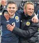  ??  ?? Johnny Russell celebrates with James Forrest last Tuesday night