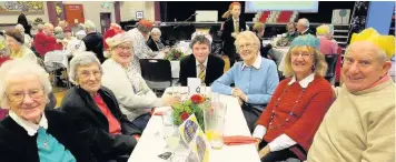  ??  ?? Guests and pupils enjoying the community Christmas party at Mount Carmel High School