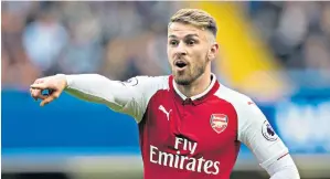  ??  ?? Power pack: Aaron Ramsey is developing into the complete central midfielder at Arsenal, according to his manager, Arsene Wenger