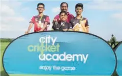  ??  ?? ↑ From left: Ryan Flory, YTCA head coach Shahzad Altaf, Mohsin Hasnain and Dev Narayan at the City Cricket Academy ground in Leicester.