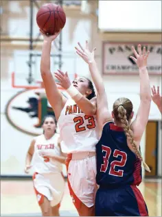  ?? RECORDER PHOTO BY CHIEKO HARA ?? Portervill­e High School's Jewelia Maniss, left, takes it to the hoop as Strathmore High School's Paige Borges attempts to guard Thursday during the first half at Portervill­e.