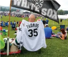  ?? JIM MCISAAC/GETTY IMAGES FILE ?? A fan of 2014 inductee Frank Thomas camps out in Cooperstow­n before the speeches began in July.