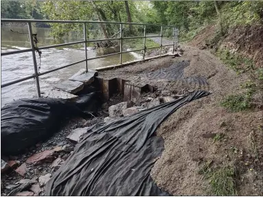  ?? SUBMITTED PHOTO SUBMITTED PHOTO ?? A sinkhole is pictured along a point of the Schuylkill River Trail.
A portion of the Schuylkill East trail is destroyed following the remnants of Hurricane Ida.