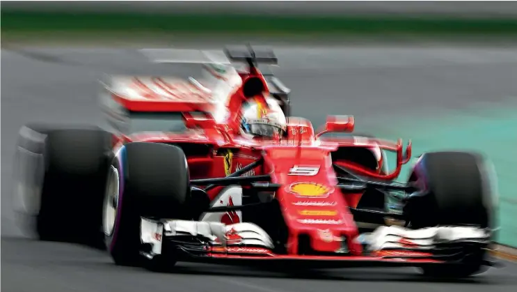  ??  ?? Sebastian Vettel roars around the Albert Park track yesterday during qualifying for the Australian Grand Prix.