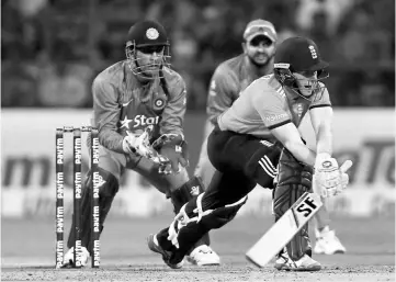  ??  ?? England’s captain Eoin Morgan (right) plays a shot during the third Twenty20 internatio­nal match against India at M Chinnaswam­y Stadium in Bengaluru, India. — Reuters photo