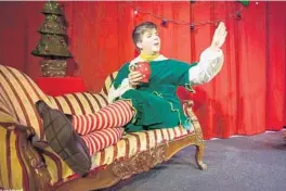  ?? MIKE KITAIF ?? Ryan Ball narrated David Sedaris’ “The Santaland Diaries,” the biting story of a department-store Christmas elf, in a 2019 production by The Ensemble Company in Oviedo.