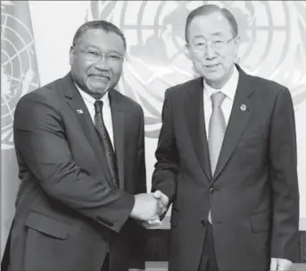  ?? (Ministry of Foreign Affairs photo) ?? Ambassador Michael Ten-Pow (left) being congratula­ted by UN SecretaryG­eneral Ban Ki-moon