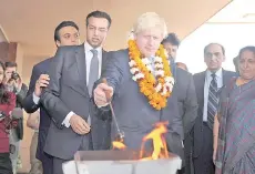  ?? Photo AFP file ?? Johnson, then London Mayor, performs a ritual on his arrival at Amity University in Noida, on the outskirts of New Delhi, on Nov 26, 2012.—