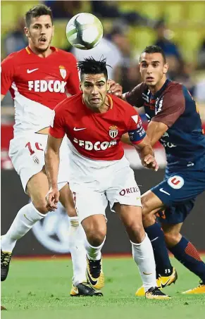  ?? — AFP ?? On target: Monaco forward Radamel Falcao (centre) heading the ball during the Ligue 1 match against Montpellie­r at the Stade Louis II in Monaco on Friday.