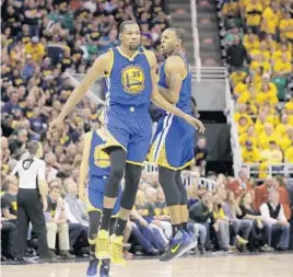  ?? RICK BOWMER/ASSOCIATED PRESS ?? The versatilit­y of 6-9 Kevin Durant, 35, and 6-6 Andre Iguodala, right, typifies the Warriors.