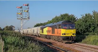  ?? STEVE SIENKIEWIC­Z. ?? GBRf’s No. 60056 – in former owner Colas colours – passes Marcheys House, with the 05.00 Tyne Coal Terminal-Lynemouth power station biomass on June 25.