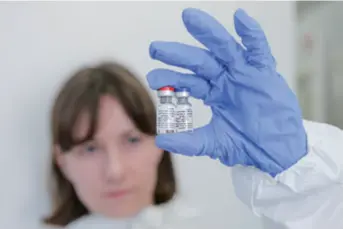  ??  ?? A researcher shows ampoules of a novel coronaviru­s disease (COVID-19) vaccine at the Gamaleya Research Institute of Epidemiolo­gy and Microbiolo­gy, Russia, on August 6