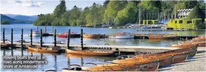  ??  ?? Rowing boats lined up in rows along Windermere‘s shore at Ambleside