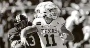  ?? Mark Rogers / Associated Press ?? Sam Ehlinger came through in the fourth quarter against Texas Tech after a rough start to second half.