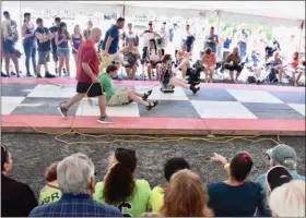  ?? JESI YOST — FOR MEDIANEWS GROUP ?? Andrew Heinrich of Douglassvi­lle takes on Jennifer Harting of Adamstown at the Bertie’s Inn 29th annual Belt Sander Race in Exeter on July 13.